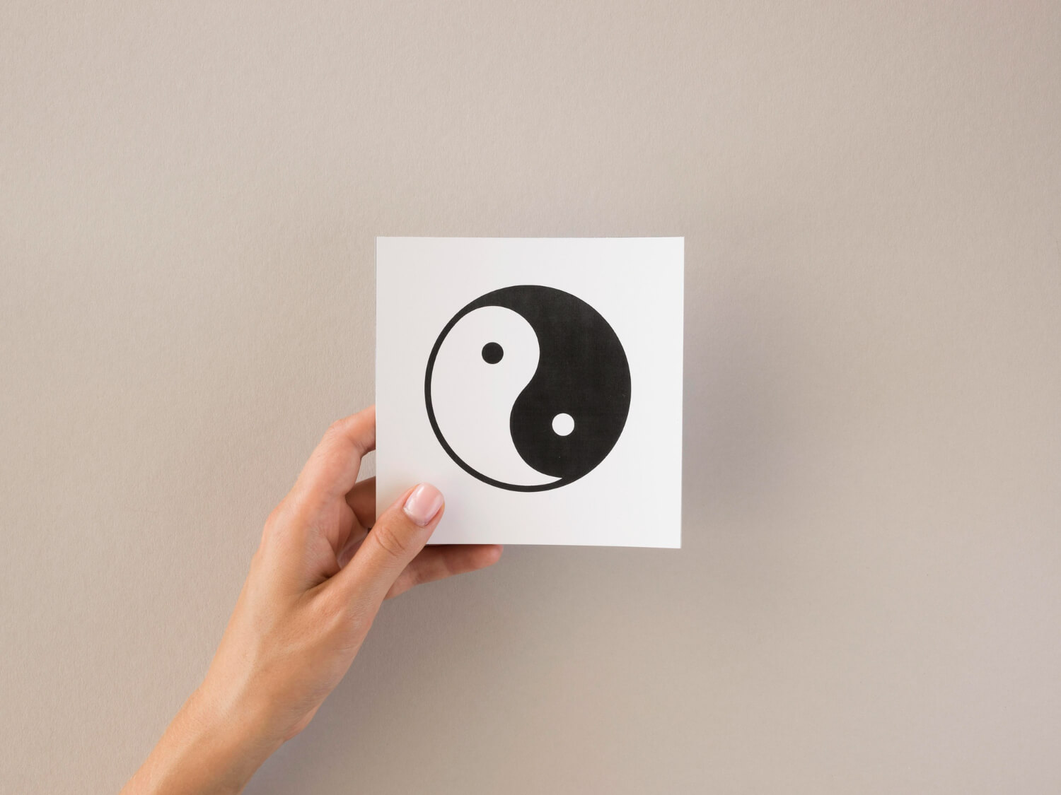 front-view-person-holding-ying-yang-symbol