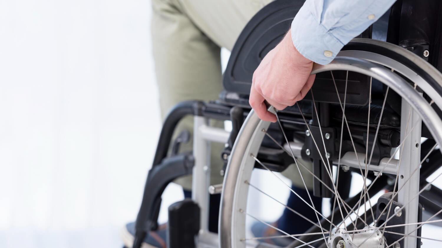 hand-wheelchair-wheel-close-up